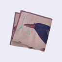 Purple square handkerchief with a graphic of a dark purple crow, with reddish purple and white feathers. It holds a hanger and has more hangers around to build a nest. Close up.