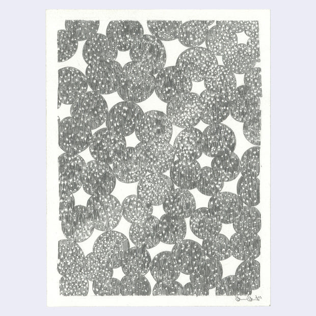 Graphite drawing of a pattern of many circles, connected to each other like a donut. Each circle has a small dotted pattern, like a starry sky.