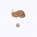 A small sleeping cat stamp and a paw print in a warm brown glittery finish on a plain white background.