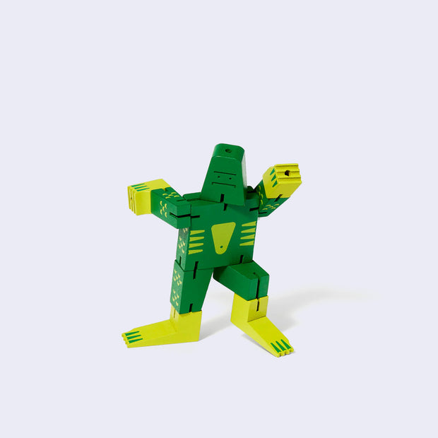 Wooden swamp monster character made of green and yellow square-like shapes, standing in a dynamic pose.