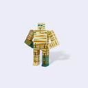 Wooden robot toy with a striped pattern of beige, tan and green made to resemble a mummy.