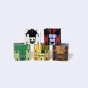 Set of colorful folded up wooden block toys on a light gray background