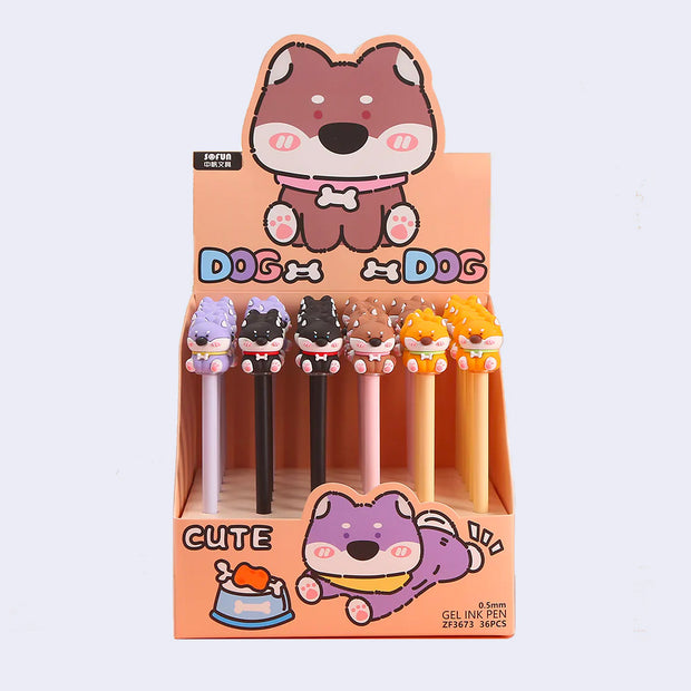 Pen display holding 36 pens with cute rubber dog toppers, of various colors. Options are: purple, black, brown and tan.