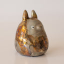 Ceramic sculpture of Totoro, covered in a bronze coloring with the effect of raku fired ceramics.