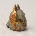 Ceramic sculpture of Totoro, covered in a bronze coloring with the effect of raku fired ceramics.