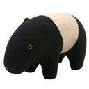 Small wooden figurine of a tapir, black and cream colored .