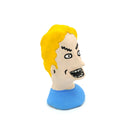 A small sculpted bust figure of a cartoon-style man with bright yellow hair, a beige face, black facial details, and a blue shirt on a plain white background.