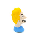 A small sculpted bust figure of a cartoon-style man with bright yellow hair, a beige face, black facial details, and a blue shirt on a plain white background.
