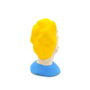 A small sculpted bust figure of a cartoon-style man with bright yellow hair, a beige face, black facial details, and a blue shirt on a plain white background.