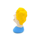 A small sculpted bust figure of a cartoon-style man with bright yellow hair, a beige face, black facial details, and a blue shirt on a plain white background.