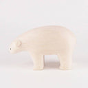 White polar bear figurine on a white background