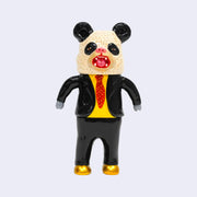 Vinyl doll of a business man, wearing a large panda head over his own. He wears a black suit, yellow shirt and red tie. He wears golden shoes and has bear paws for hands.