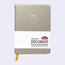 Brownish gray pleather covered sketchbook with a small embossment of a robot carrying a flag that reads "Giant Robot" in the upper center. Paper sleeve reads "Document Plots Dots and Manifestos."