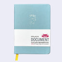 Pastel greyish blue pleather covered sketchbook with a small embossment of a robot carrying a flag that reads "Giant Robot" in the upper center. Paper sleeve reads "Document Plots Dots and Manifestos."