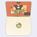 Greeting card made to look like a box of donuts with a bear shaped donut in the middle.