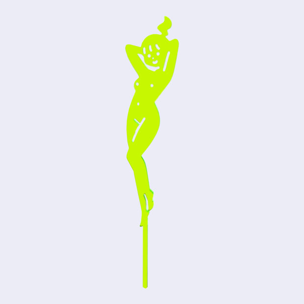 Neon green die cut drink stirrer of a nude cartoon girl, standing with her hands behind her head and wearing her hair in a ponytail.