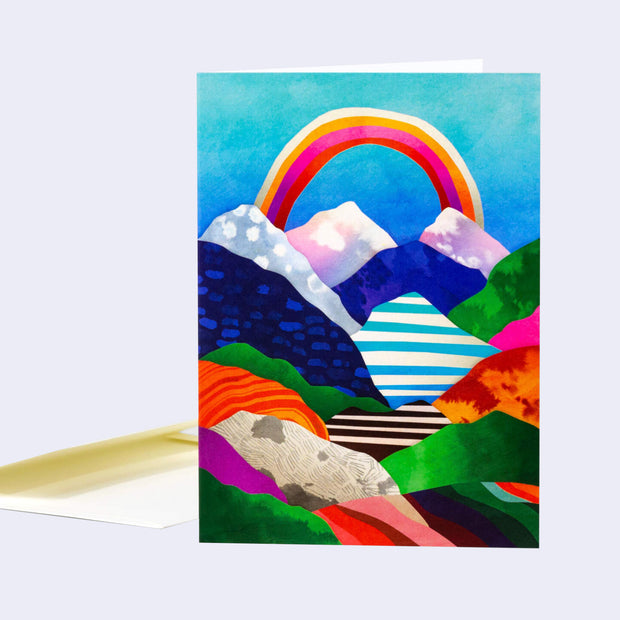Colorful mountain landscape with a rainbow on a white background