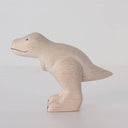 White wooden figure of a dinosaur.