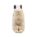 Carved wooden figure of a white rabbit.