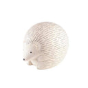 White wooden hedgehog figurine on a white background