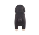 Black dog-shaped figurine on a white background