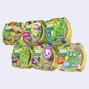 6 different yellow containers containing seeds with cute graphics on top, for growing your own plants - 6 different varieties.