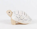 Wooden figurine of a turtle with a patterned shell