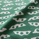 Green fabric with white geometric pattern