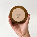 Underside of wooden base with artist's signature.