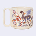 Mug with dragon and floral design on a white background