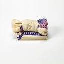 Folded fabric with a pattern on a white background