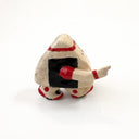 A small hand-painted ceramic figurine of a character resembling an onigiri, wearing red sweatband, and black and red basketball sneakers, holding an orange basketball and pointing, set against a plain white background.