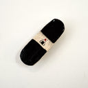 Ceramic skateboard, seen from overhead with black grip tape and a central graphic of an onigiri with a red dot on top.