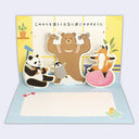 Pop-up card with cartoon animals on a light blue background