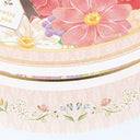 Floral design with pink flowers and decorative elements on a card