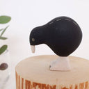 Black and white bird figurine on a white background