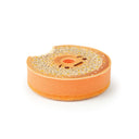 Sponge shaped and designed to look like an everything bagel with a bite taken out of it.