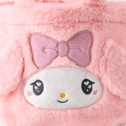 Fluffy pink faux fur handle bag with My Melody's face on the front with 3D fluffy ears and an embroidered pink box over her forehead. Her eyes have a cute, kawaii sparkle. Close up.