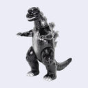 A glossy black Godzilla toy figure with silver claws and feet, standing on a light gray background.