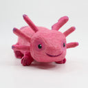 Whittled wooden sculpture of a pink, smiling axolotl.