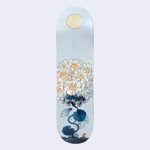 Light blue skate deck featuring an illustration of a large collective of blooming white flowers with yellow centers, attached to a wavy dark teal stem. At the bottom is a small pink worm and at the top middle of the deck is a yellow sun.