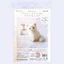 Packaging for a needle felting kit of a Persian cat, white a fluffy sitting with a happy, curious expression.