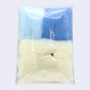 Backside of needle felting kit, with all the necessary fabric and small black eyes.
