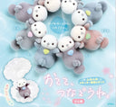 Collection of small flocked toys resembling seals on a light blue background with Japanese text.