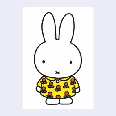 White postcard of Miffy standing and wearing a floral yellow dress with red flower and green leaves.