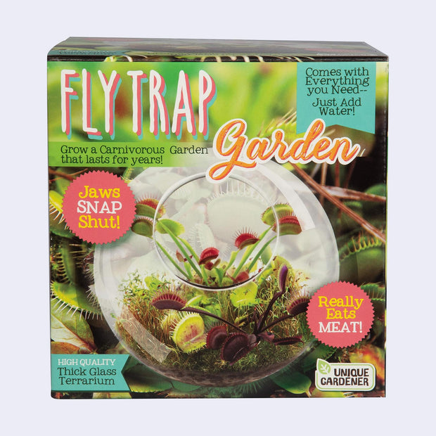 Product packaging for a Fly Trap Garden - glass terrarium kit where a Venus Fly Trap can be grown.