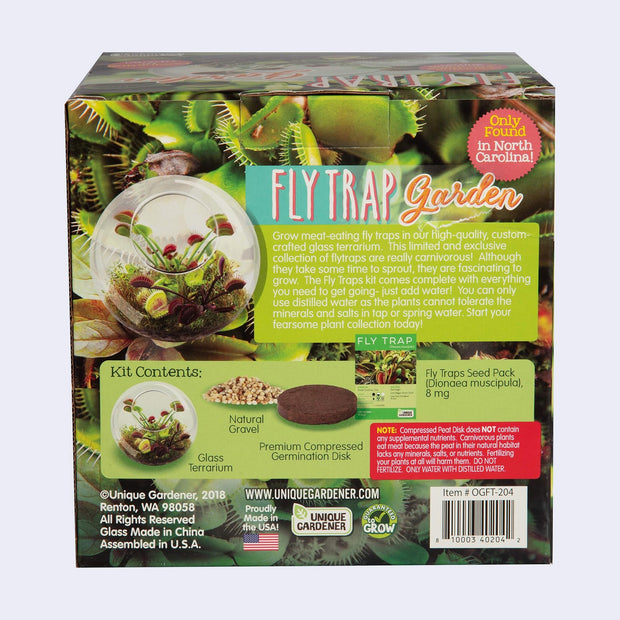 Product packaging for a Fly Trap Garden - glass terrarium kit where a Venus Fly Trap can be grown. Backside so contents and a brief description.