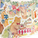 Greeting card with Japanese text and an illustration of a group of forest animals having a birthday party. Close up detailing