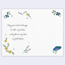 Motivational card with floral design and inspirational quote on a light purple background