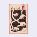 Rectangular cream colored towel with a pink outline and imagery of a pink embroidered fox, jumping down into burrows that can be seen from the side, Each burrow has small seeds stored and small green mice.